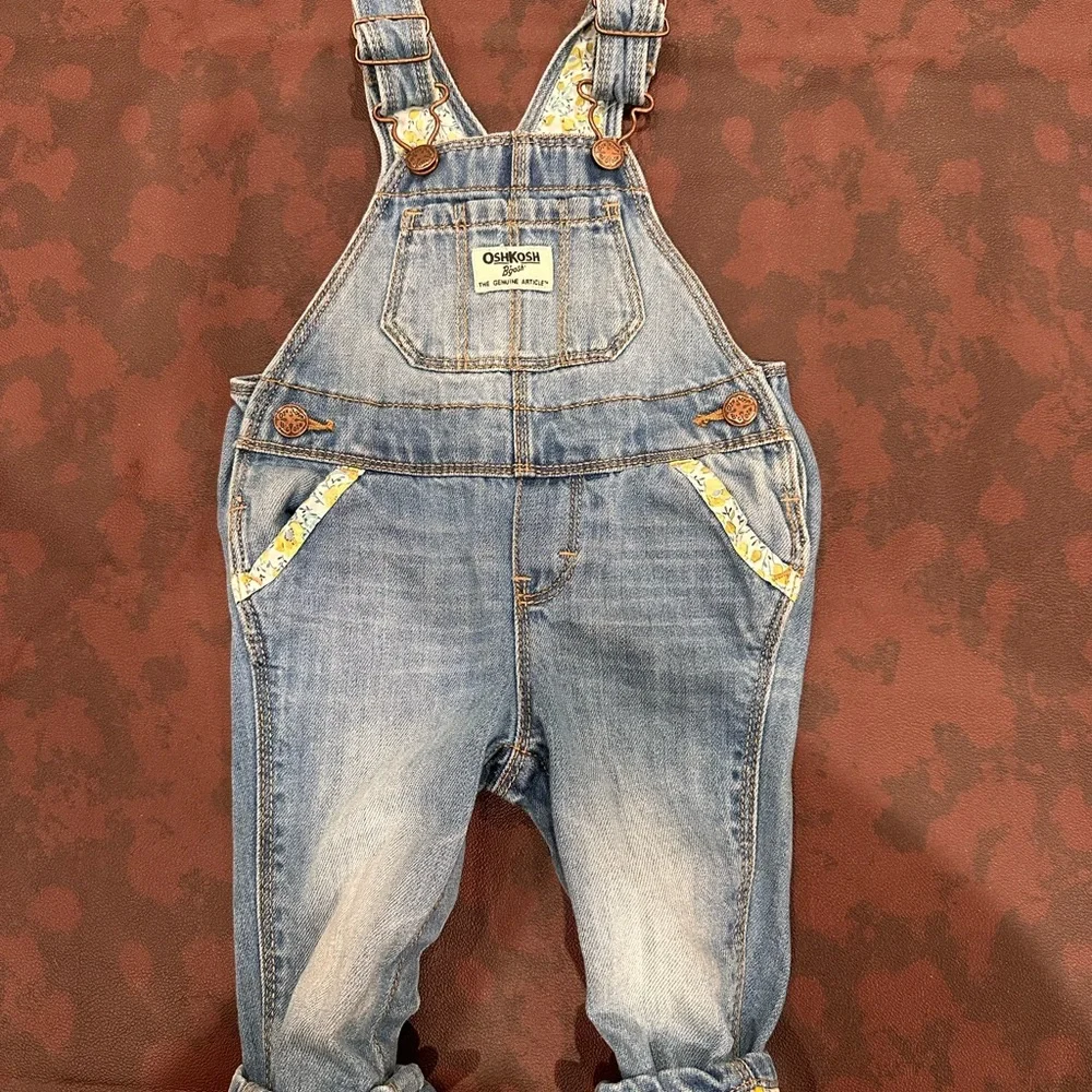 OshKosh B'gosh‎ Light Blue Denim Overalls with Flower Accents 6-9 months